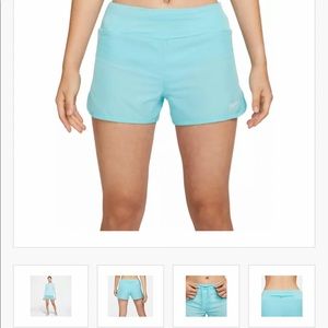 Blue Nike running shorts